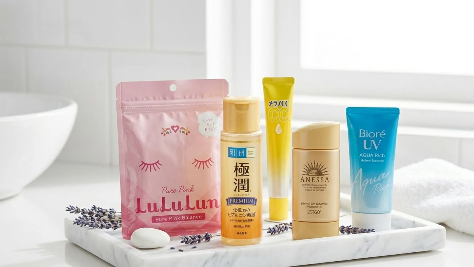 Curated selection of best Japanese skincare products arranged on a marble tray in a bright Tokyo bathroom setting