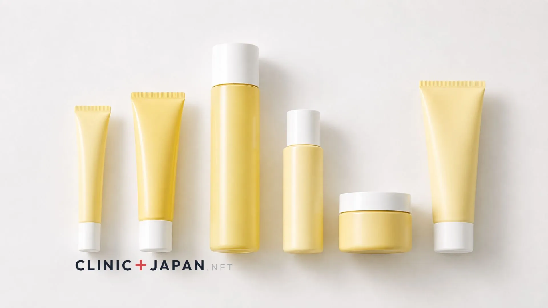 Melano CC product range laid out — the yellow spot-focus essence tube, premium essence, brightening lotion, emulsion and enzyme cleanser on a plain surface