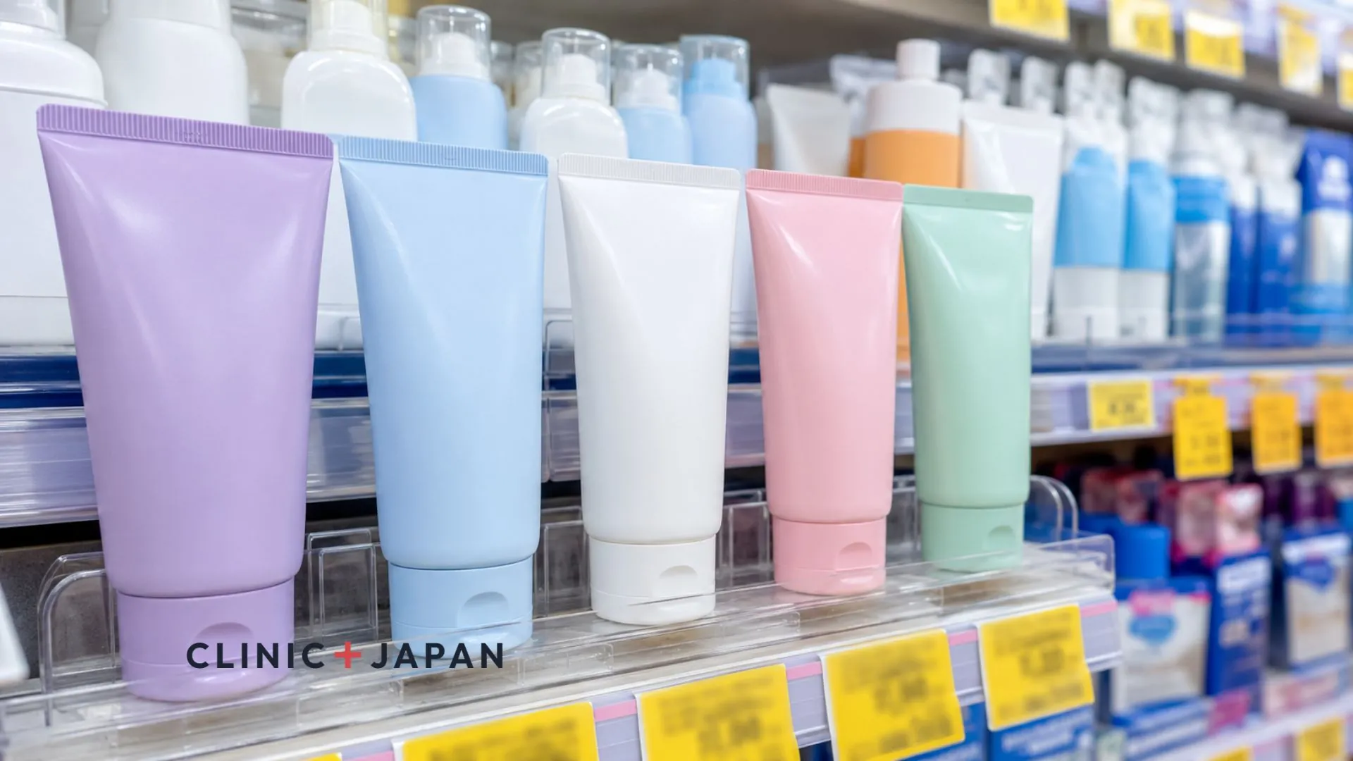 Skin Aqua tone up UV essence tubes lined up on a Japanese drugstore shelf beside competing sunscreen brands with discount tags